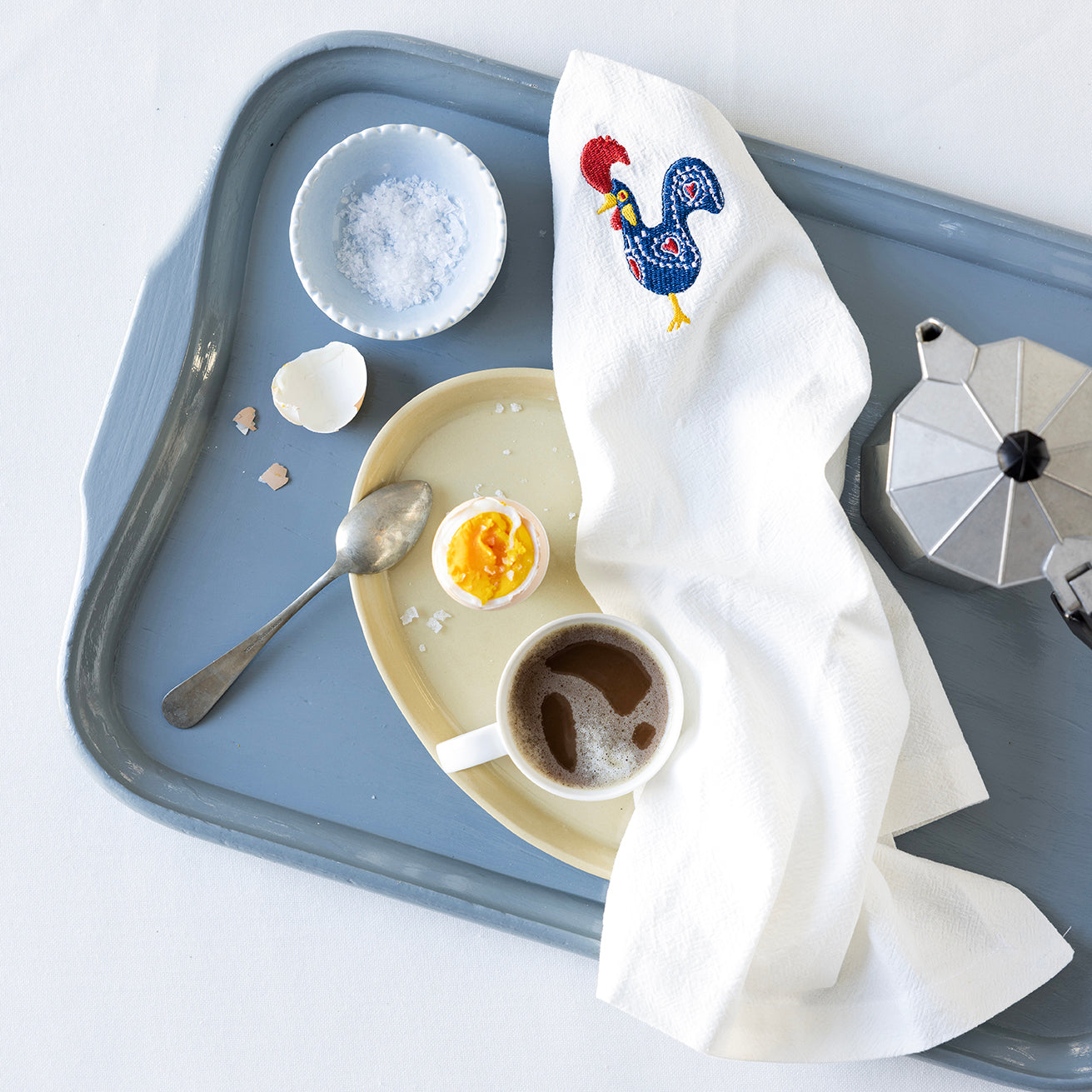 Servett med broderad tupp