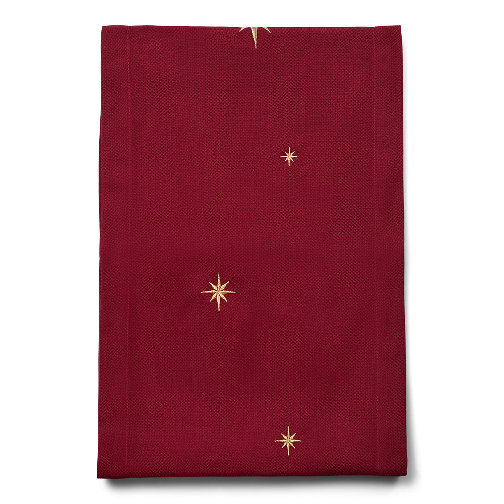 Mörkröd bordslöpare med guldstjärnor